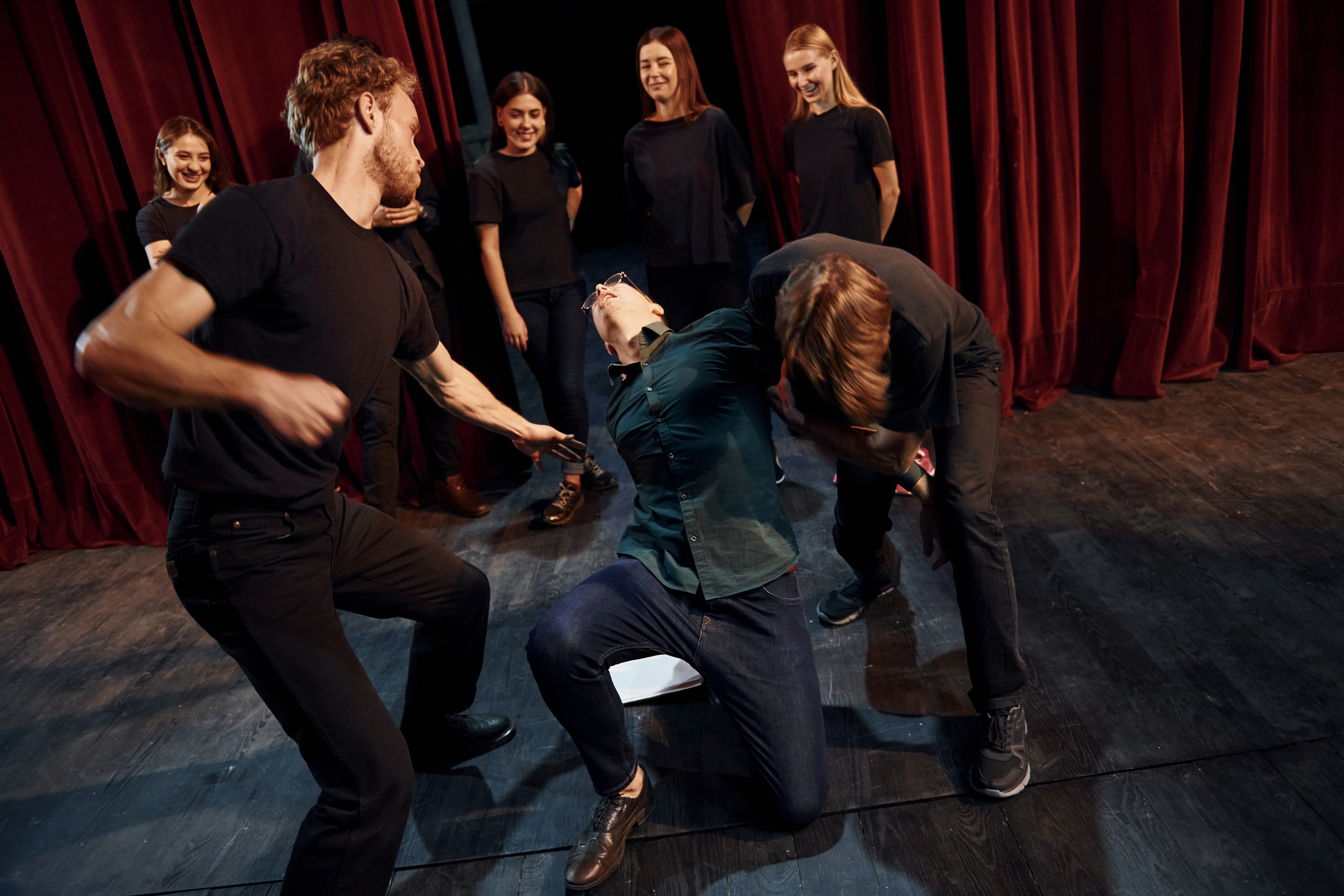Fight Scene. Group of Actors in Dark Colored Clothes on Rehearsal in the Theater